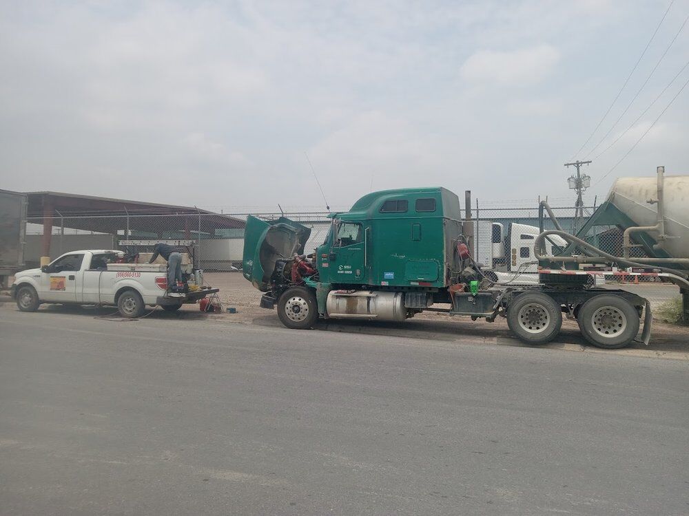 Tractors parked in a customer yard during a fleet service call