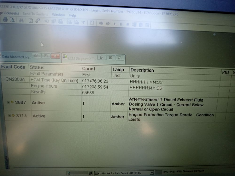 Diagnostic software showing an aftertreatment DEF dosing valve fault and an engine torque derate