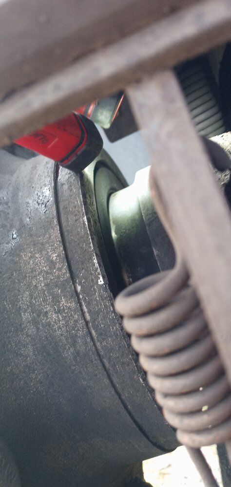 Air line coiled beside a truck tire during a roadside air system check in the Rio Grande Valley